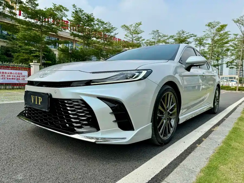 Toyota Camry Hybrid reference vehicle photographed from the front three-quarter angle